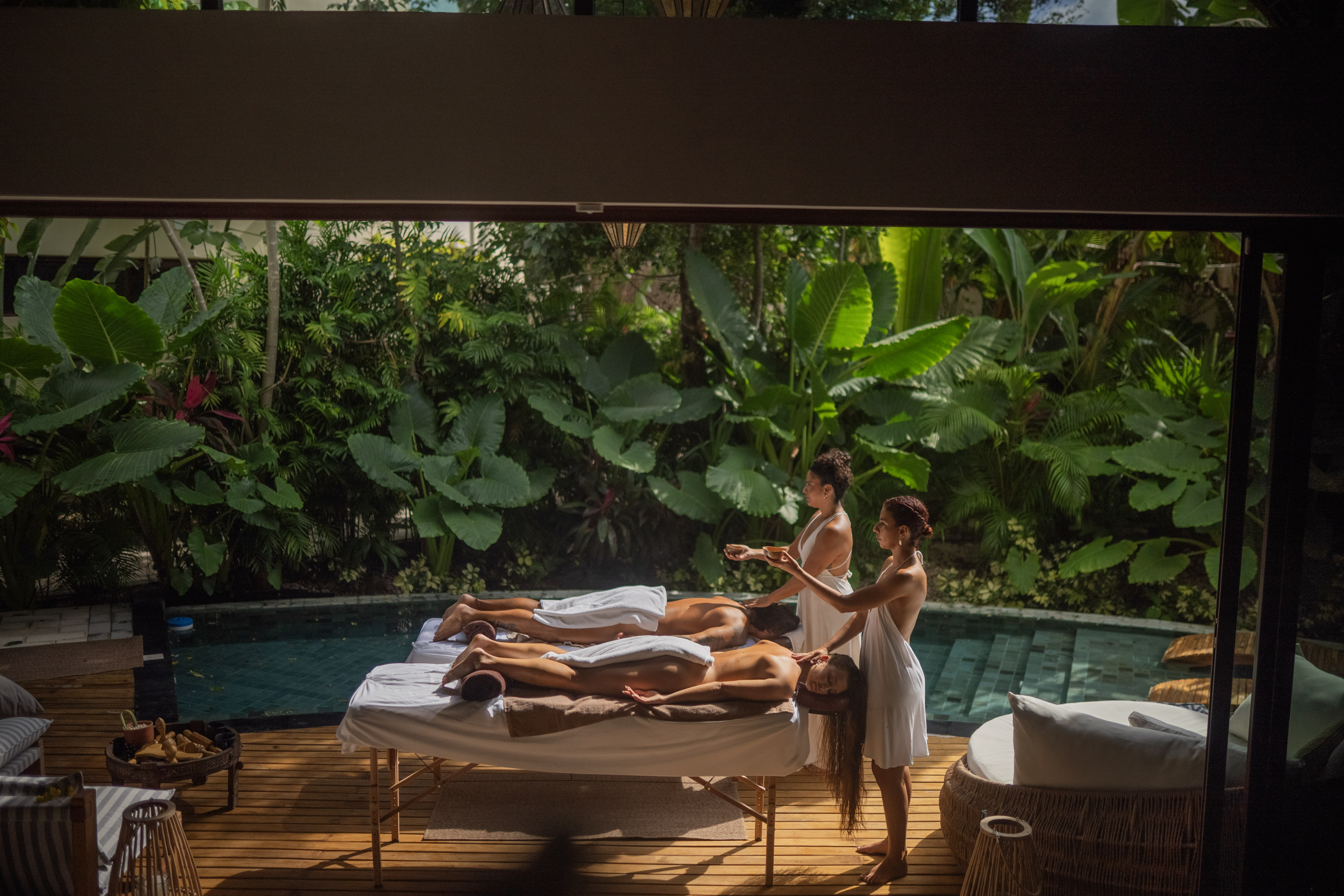 Couples massage by pool